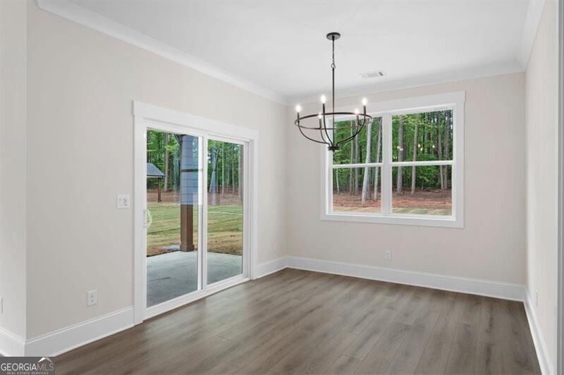 150 Doris Path Dallas, GA 30157 - Photo 12 of 36 a view of an empty room with wooden floor and a window
