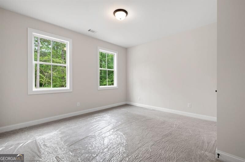 150 Doris Path Dallas, GA 30157 - Photo 26 of 36 an empty room with windows