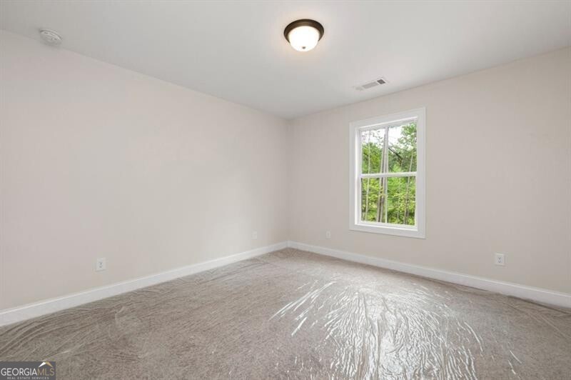 150 Doris Path Dallas, GA 30157 - Photo 29 of 36 an empty room with a window