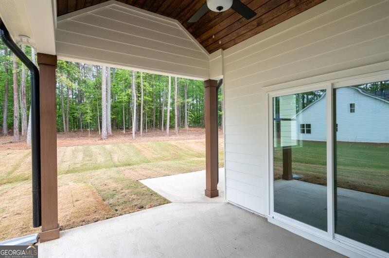 150 Doris Path Dallas, GA 30157 - Photo 32 of 36 a view of porch with a floor to ceiling window and a yard