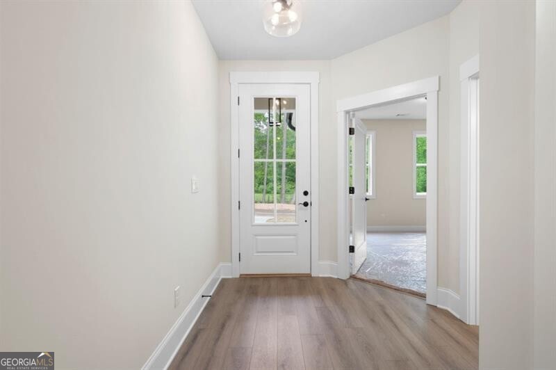 150 Doris Path Dallas, GA 30157 - Photo 6 of 36 an empty room with wooden floor and windows