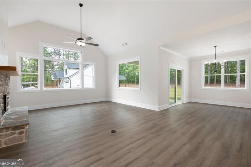 150 Doris Path Dallas, GA 30157 - Photo 8 of 36 a view of an empty room with wooden floor and a window