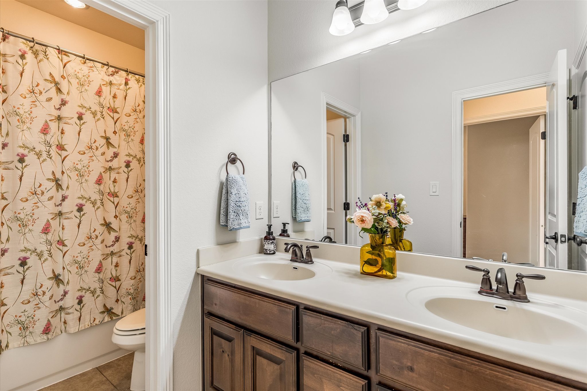 226 Galloway Lane Austin, TX 78737 - Photo 22 of 30 Bathroom featuring double vanity and light tile patterned floors
