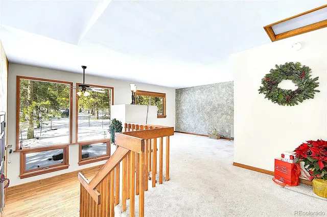 a view of balcony with wooden floor and outdoor seating