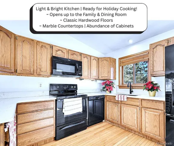 an aerial view of house with yard and mountain view in back