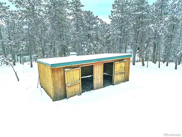 a view of a livingroom with furniture and a window