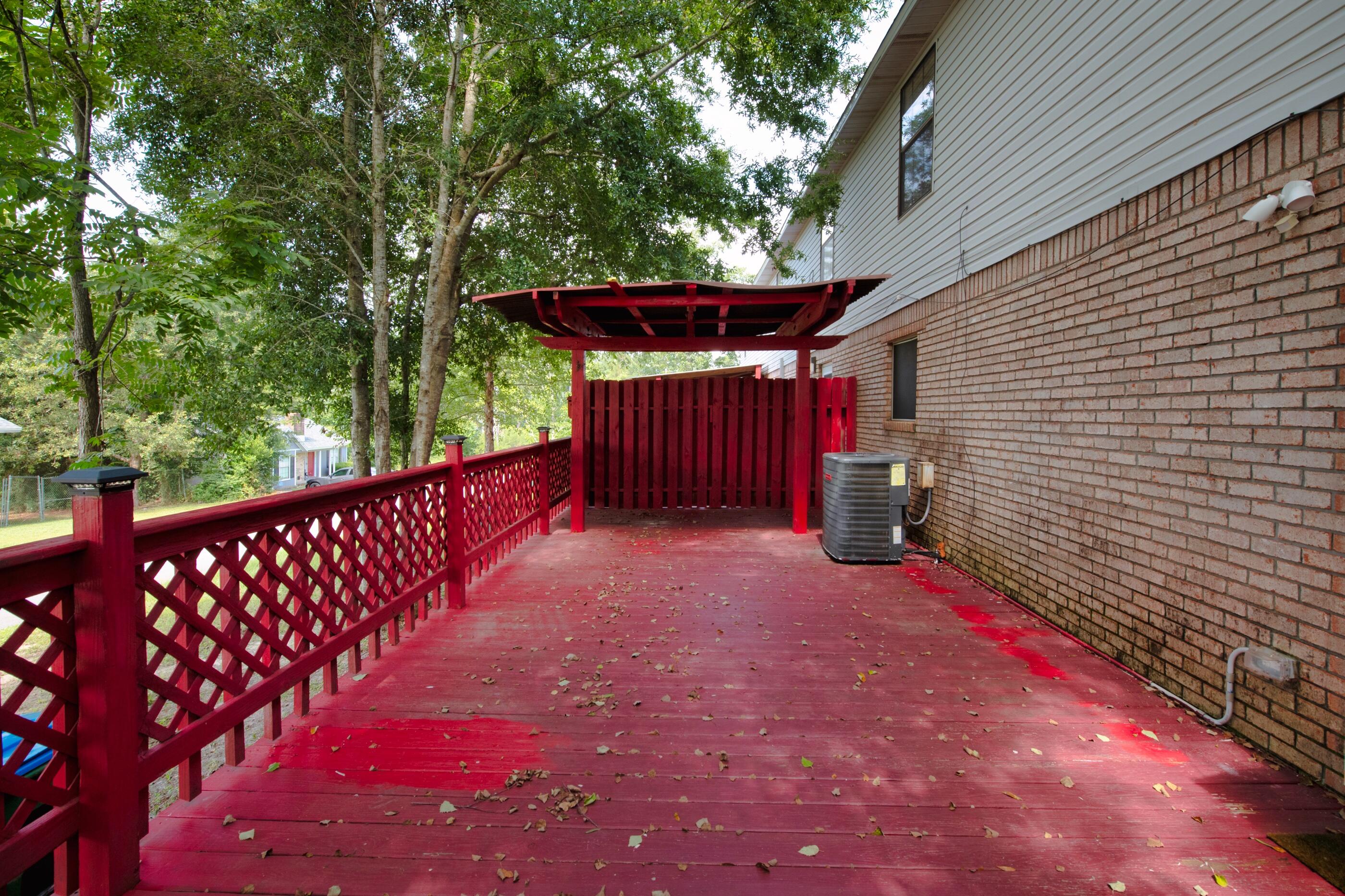 701 Valley Road, Unit 1 Crestview, FL 32539 - Photo 17 of 20 a view of a backyard with a large tree