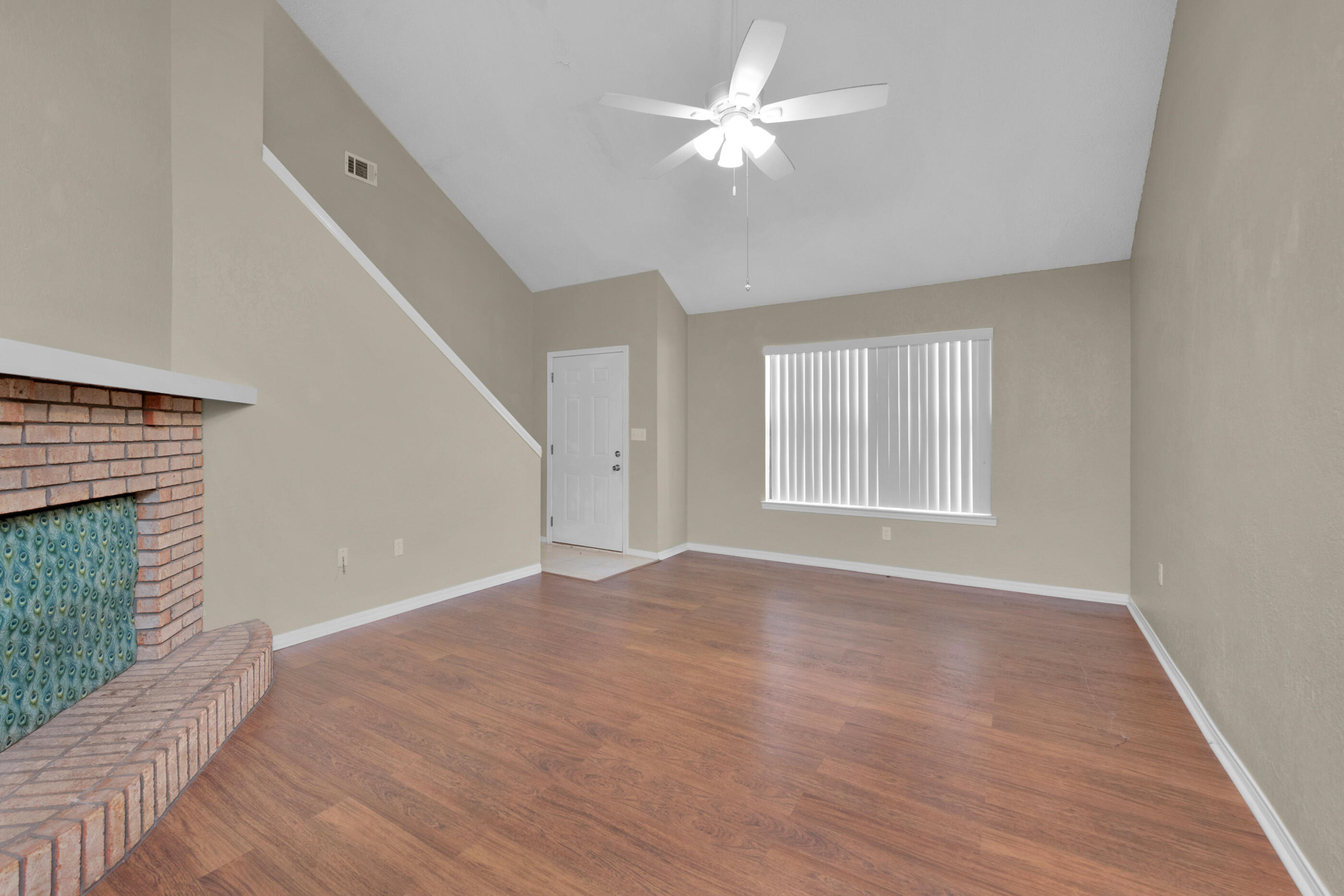 701 Valley Road, Unit 1 Crestview, FL 32539 - Photo 5 of 20 a view of an empty room with a window and fireplace