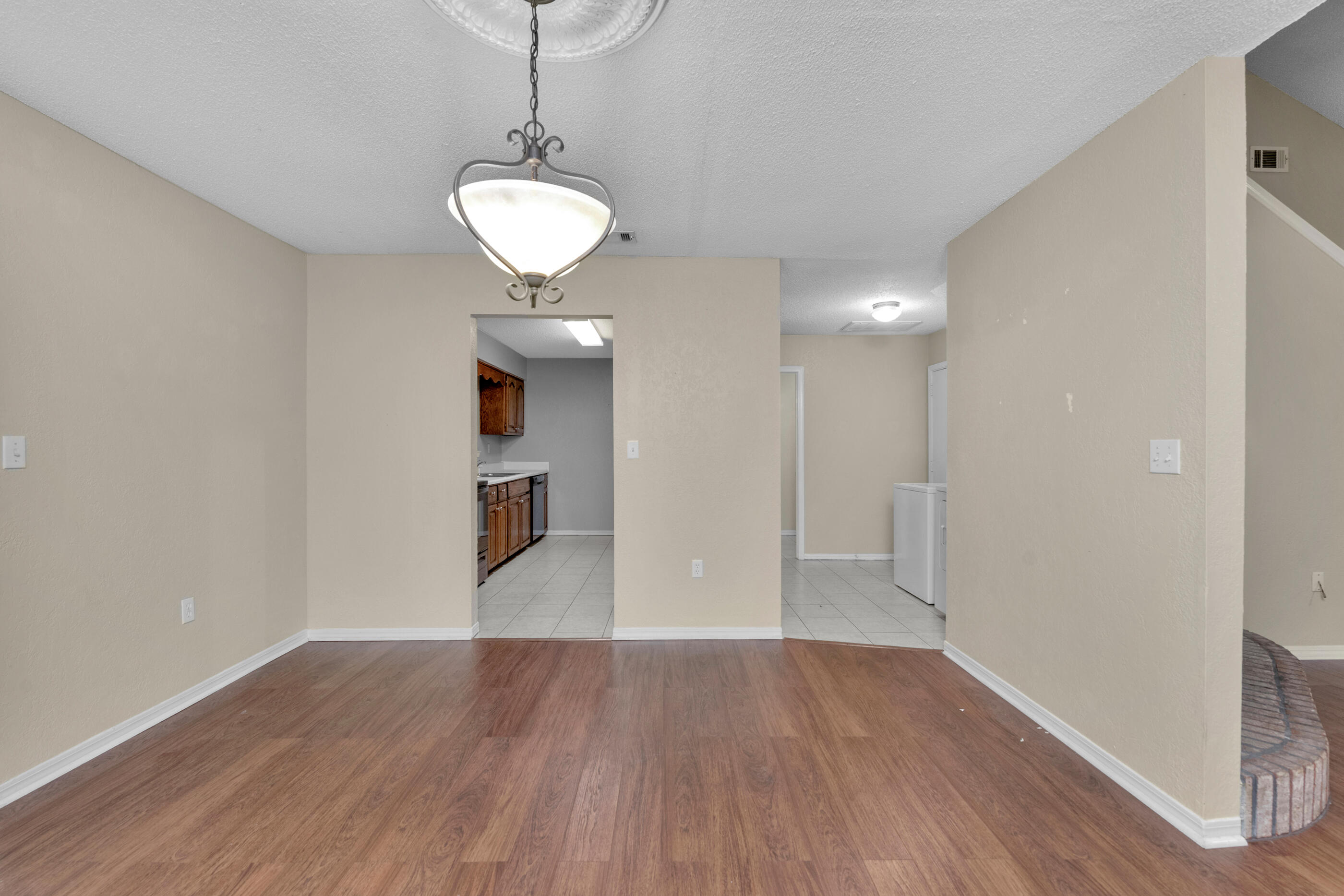 701 Valley Road, Unit 1 Crestview, FL 32539 - Photo 8 of 20 a view of a room with wooden floor and a window