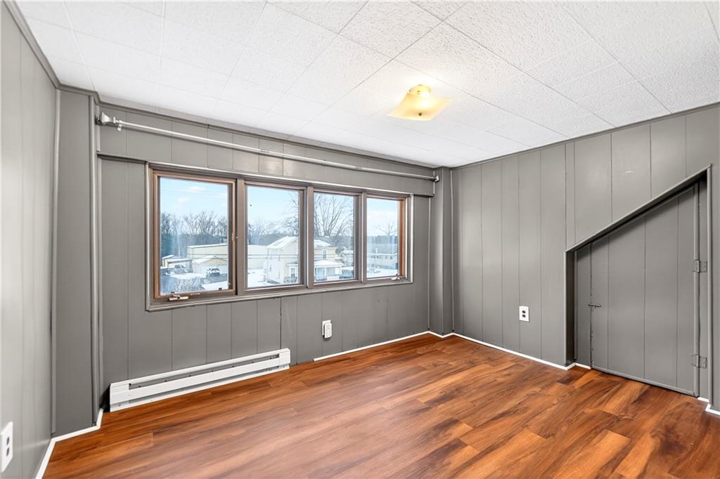 66 Conneaut Lake Road Greenville, PA 16125 - Photo 17 of 30 a view of an empty room with wooden floor and a window
