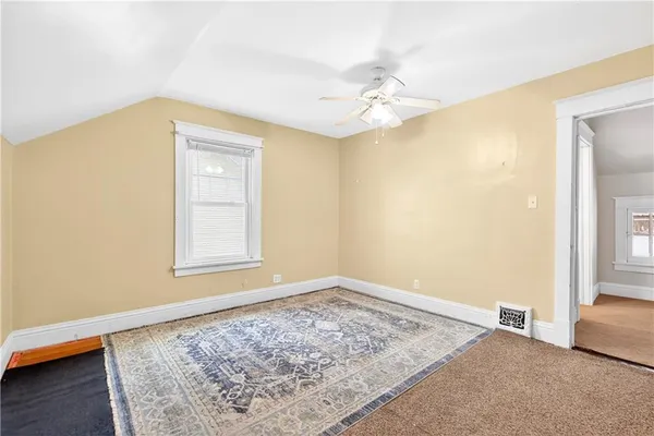 a bathroom with a shower sink vanity mirror and toilet