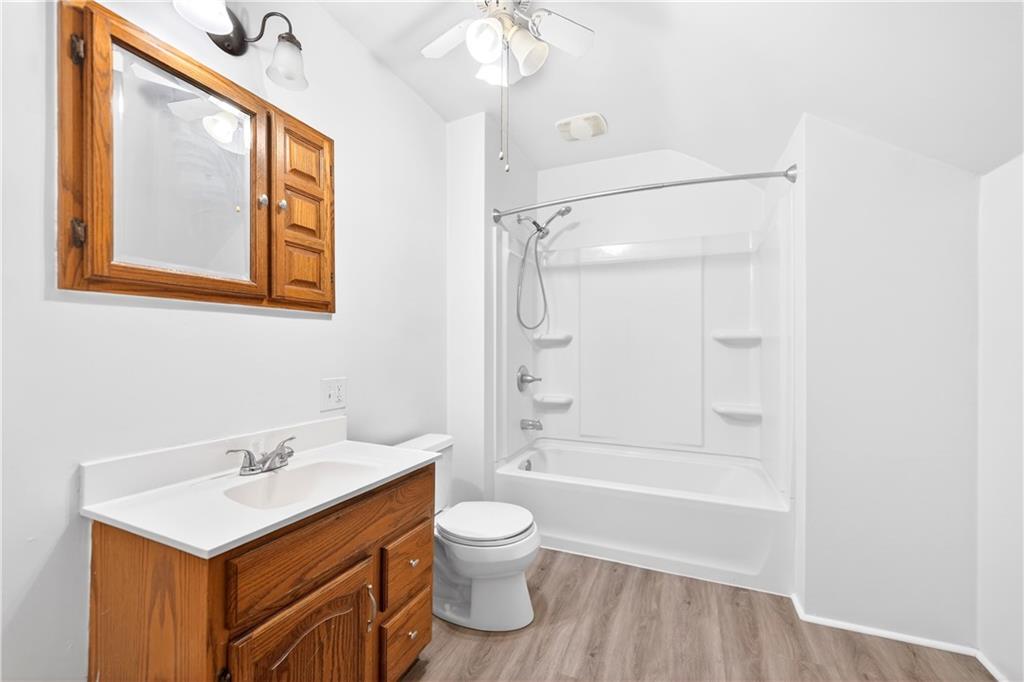 66 Conneaut Lake Road Greenville, PA 16125 - Photo 21 of 30 a bathroom with a shower sink vanity mirror and toilet