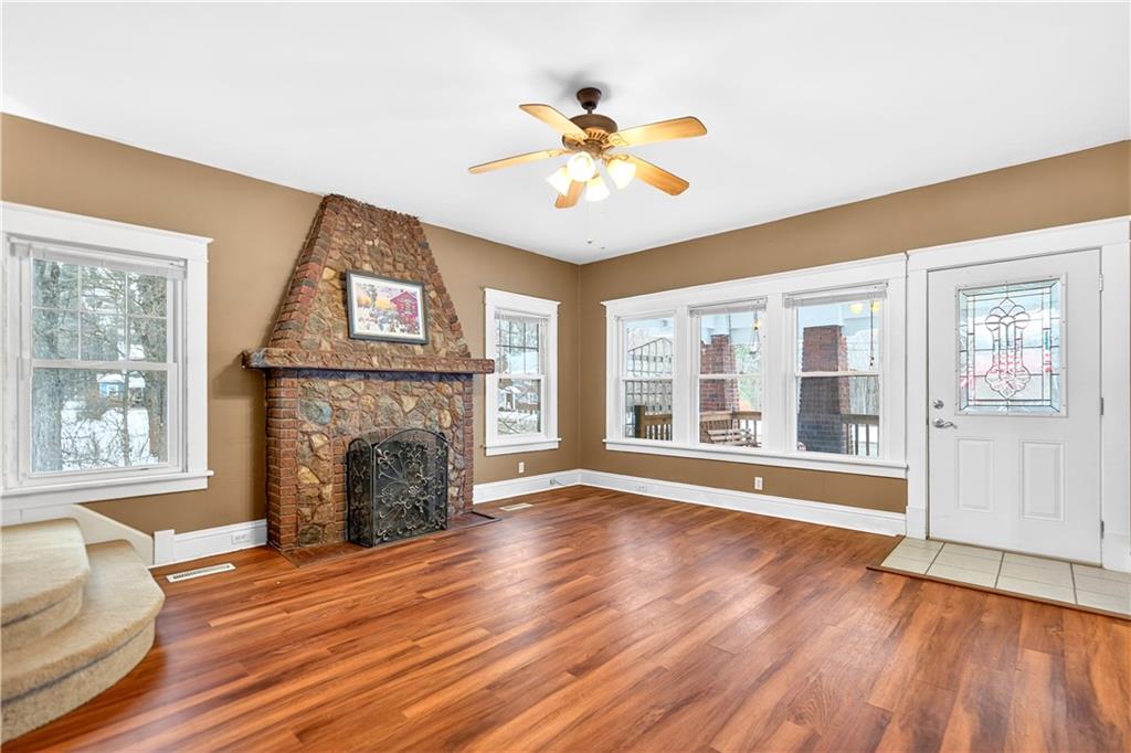 66 Conneaut Lake Road Greenville, PA 16125 - Photo 7 of 30 a view of an empty room with wooden floor and a window