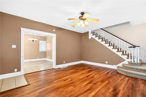 a view of an entryway and wooden floor