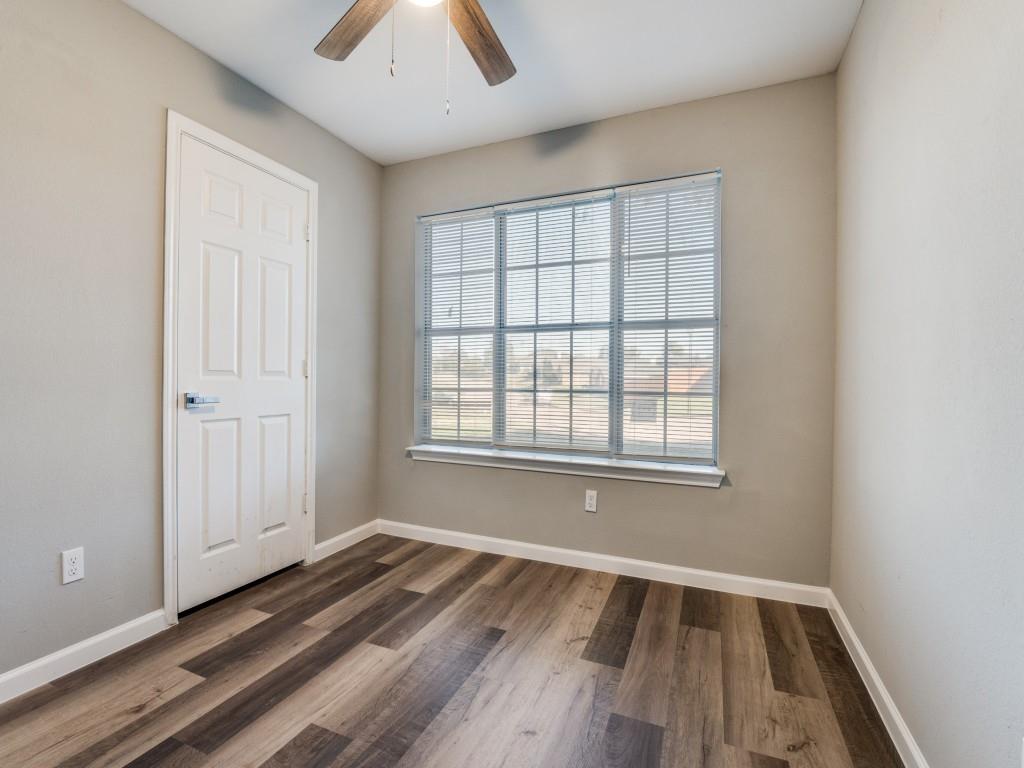4523 Hamblen Drive Dallas, TX 75232 - Photo 15 of 25 an empty room with wooden floor and windows