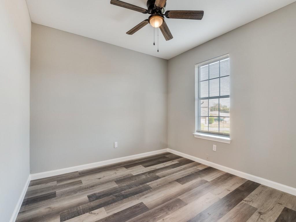 4523 Hamblen Drive Dallas, TX 75232 - Photo 16 of 25 wooden floor in an empty room with a window