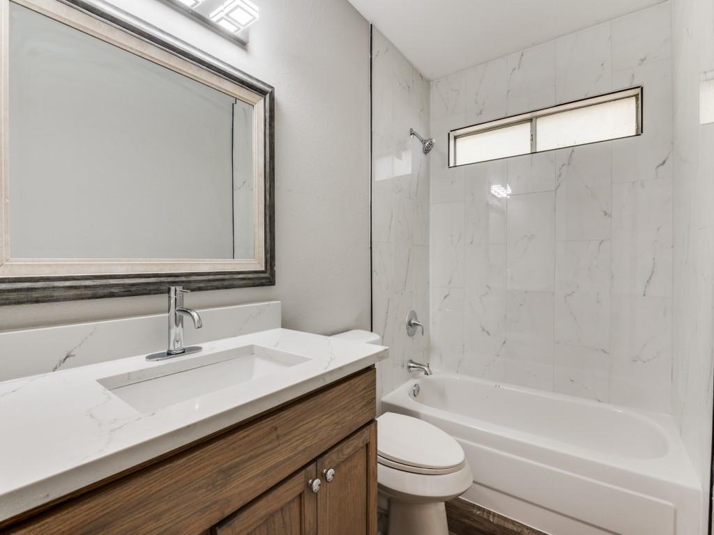 4523 Hamblen Drive Dallas, TX 75232 - Photo 17 of 25 a bathroom with a sink a toilet and shower
