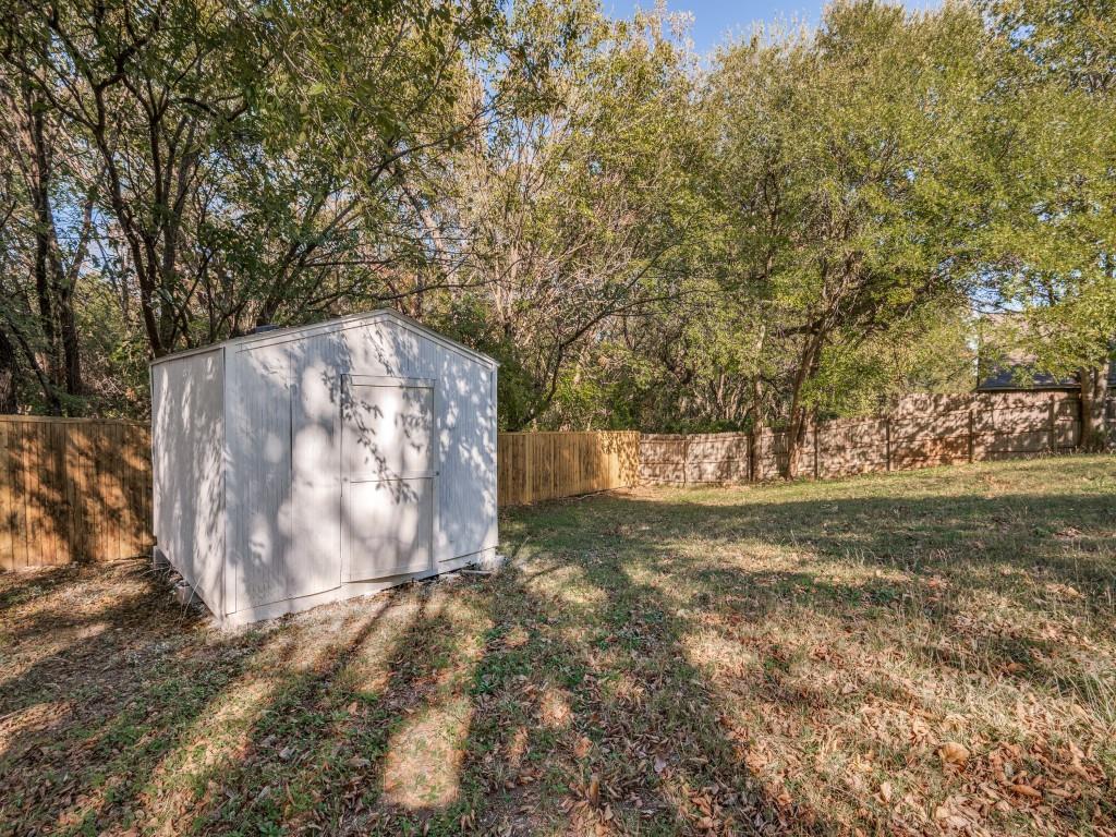 4523 Hamblen Drive Dallas, TX 75232 - Photo 24 of 25 a backyard of a house with trees and outdoor space