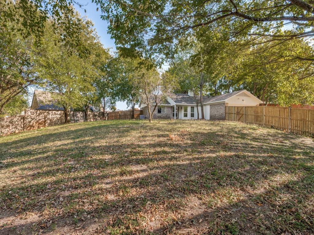4523 Hamblen Drive Dallas, TX 75232 - Photo 25 of 25 a front view of a house with a garden