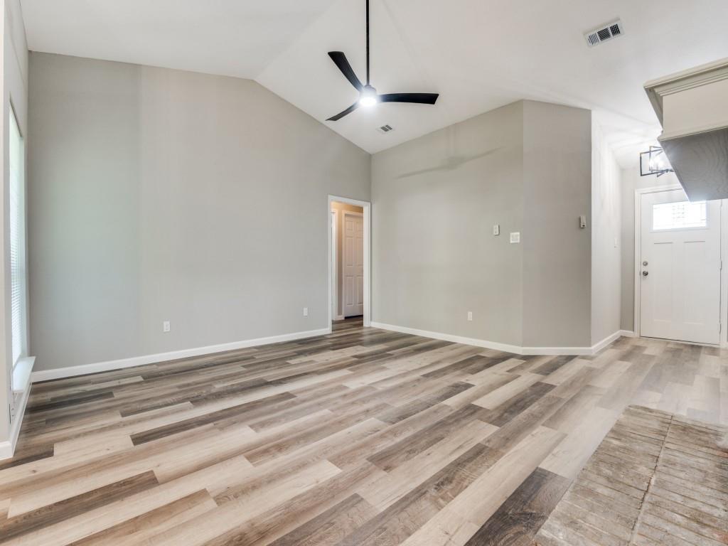 4523 Hamblen Drive Dallas, TX 75232 - Photo 3 of 25 a view of a livingroom with wooden floor and a ceiling fan