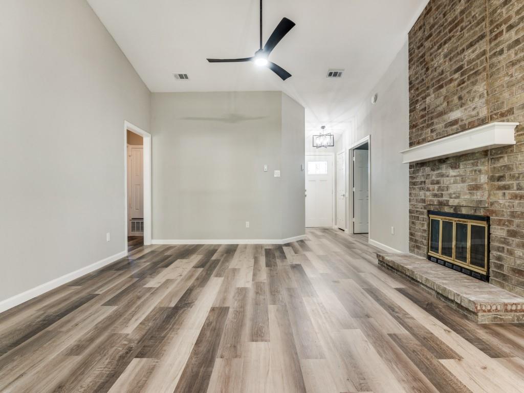 4523 Hamblen Drive Dallas, TX 75232 - Photo 4 of 25 a view of empty room with wooden floor and fan