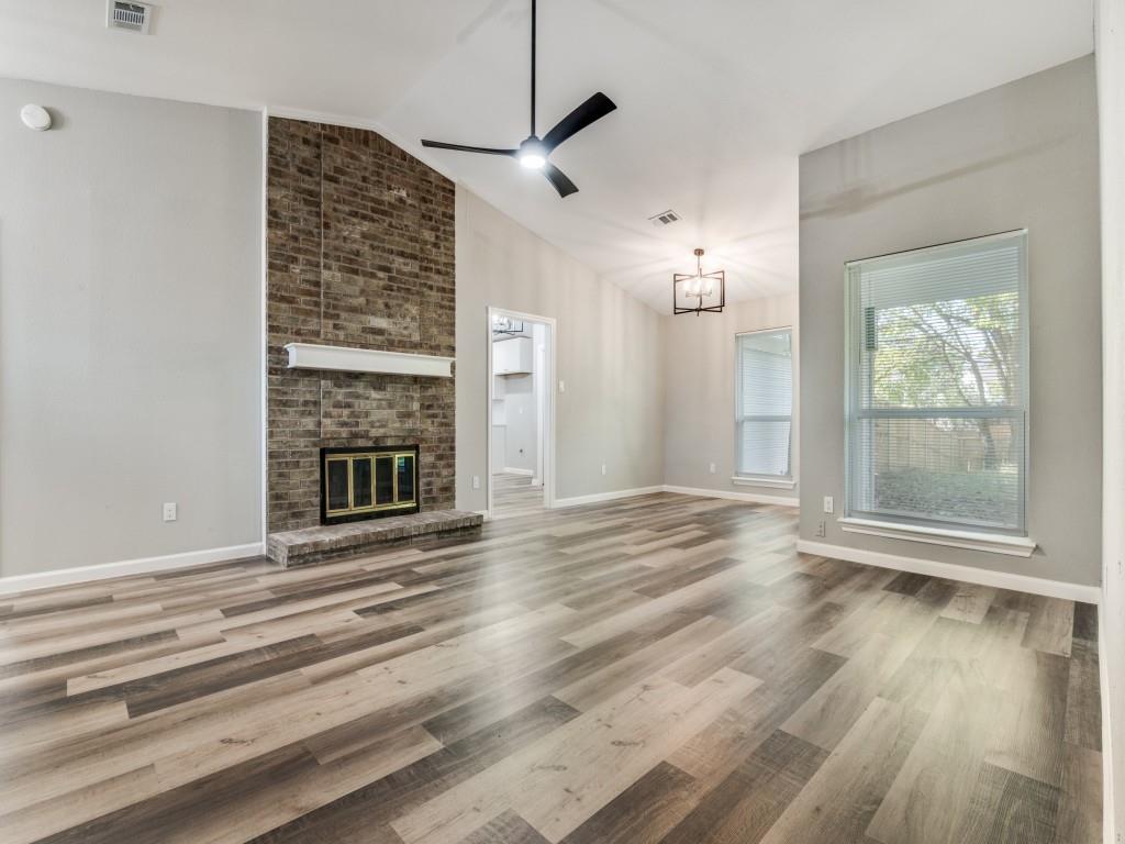 4523 Hamblen Drive Dallas, TX 75232 - Photo 5 of 25 a view of an empty room with wooden floor and a window