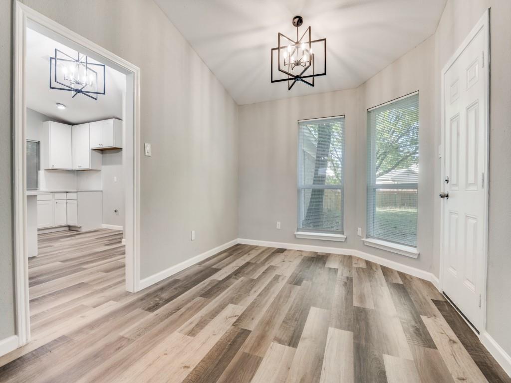 4523 Hamblen Drive Dallas, TX 75232 - Photo 7 of 25 a view of empty room with wooden floor and window