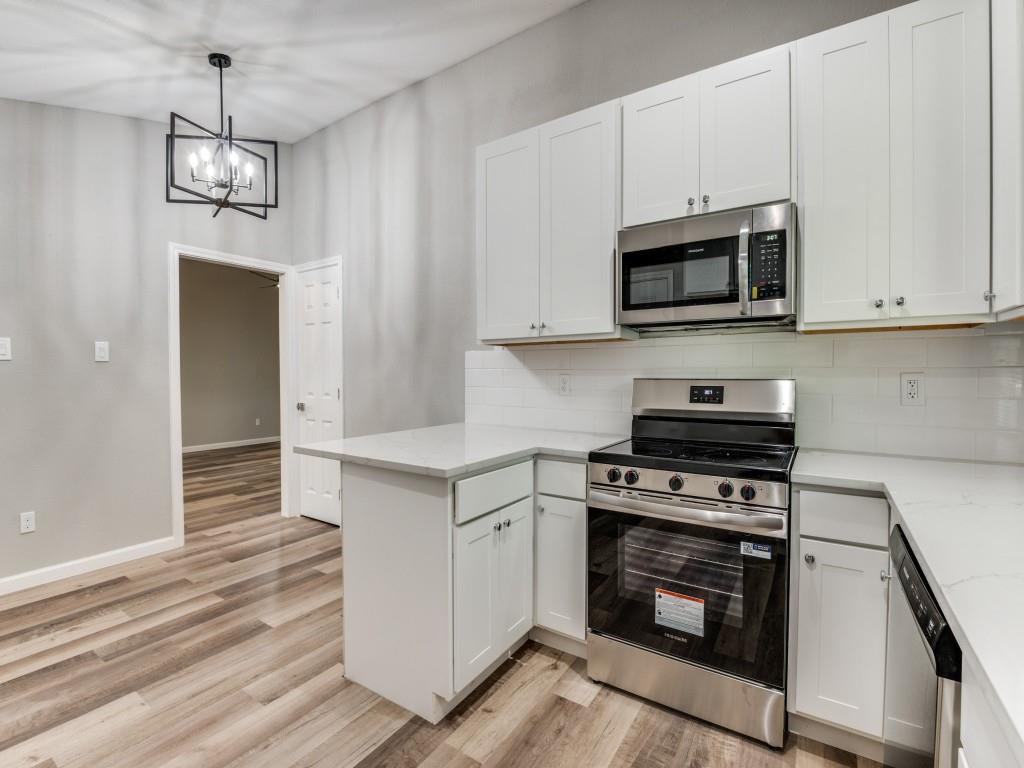 4523 Hamblen Drive Dallas, TX 75232 - Photo 10 of 25 a kitchen with stainless steel appliances granite countertop a stove and a microwave