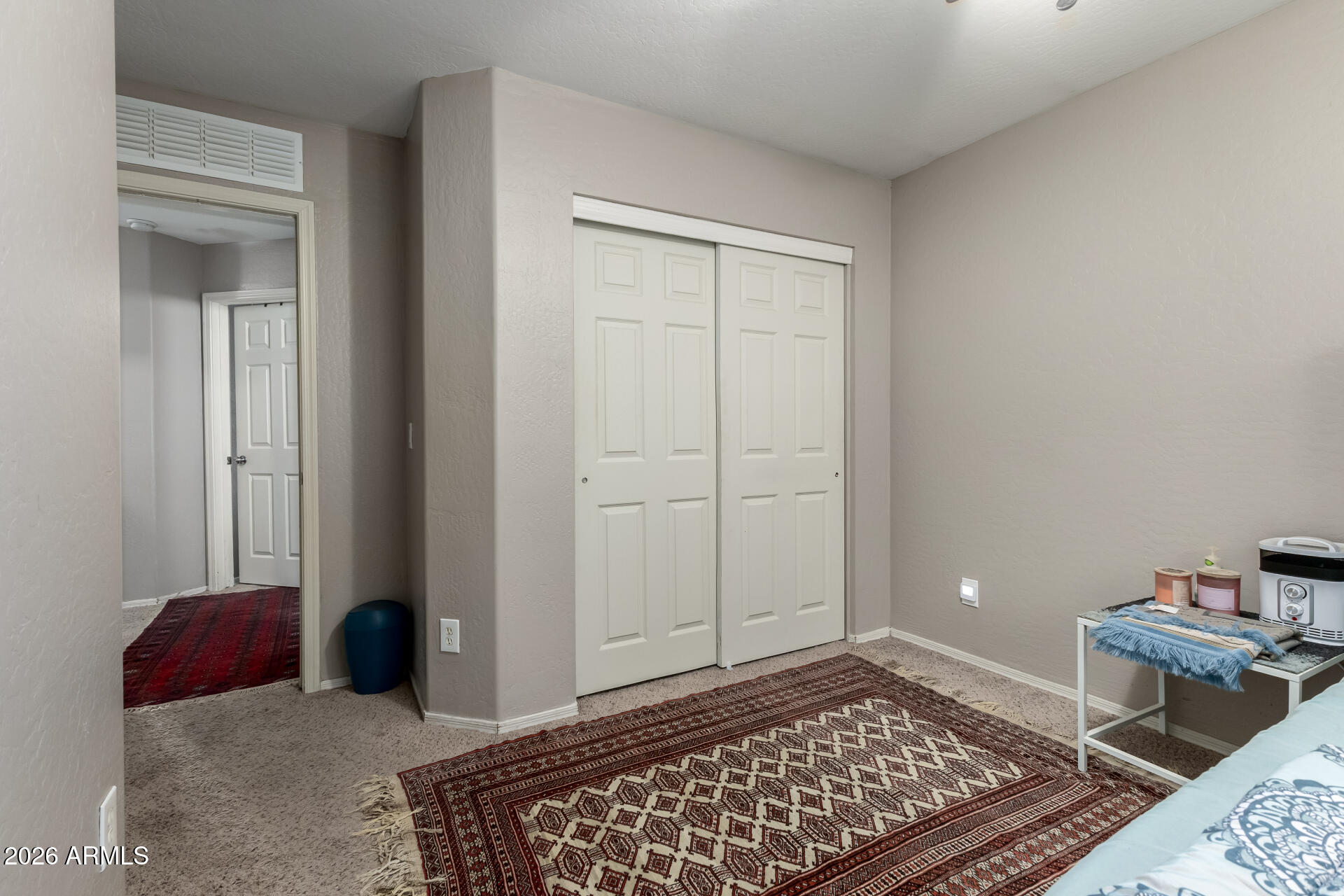 10762 West Joblanca Road Avondale, AZ 85323 - Photo 21 of 36 a bedroom with a bed and a rug