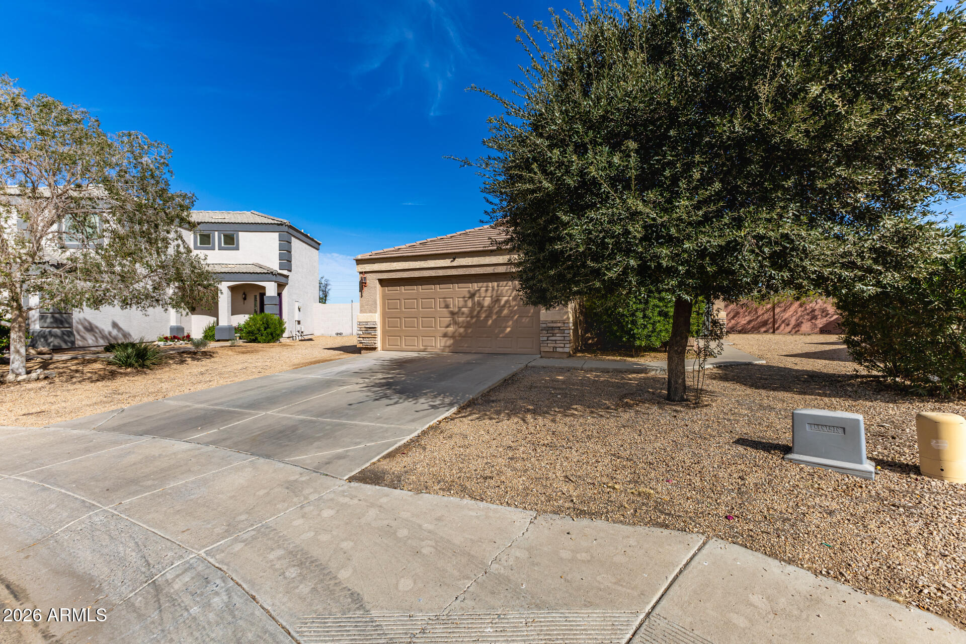 10762 West Joblanca Road Avondale, AZ 85323 - Photo 3 of 36 a front view of a house with a yard and garage