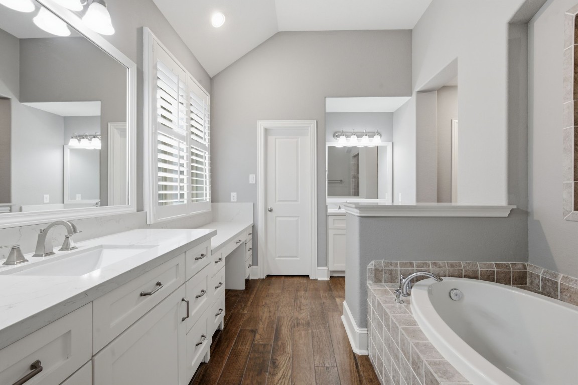 27971 Arden Trail Spring, TX 77386 - Photo 22 of 50 Primary bedroom ensuite with quartz counters, double sinks, vanity space, soaking tub, separate shower and large walk-in closet with built-ins.