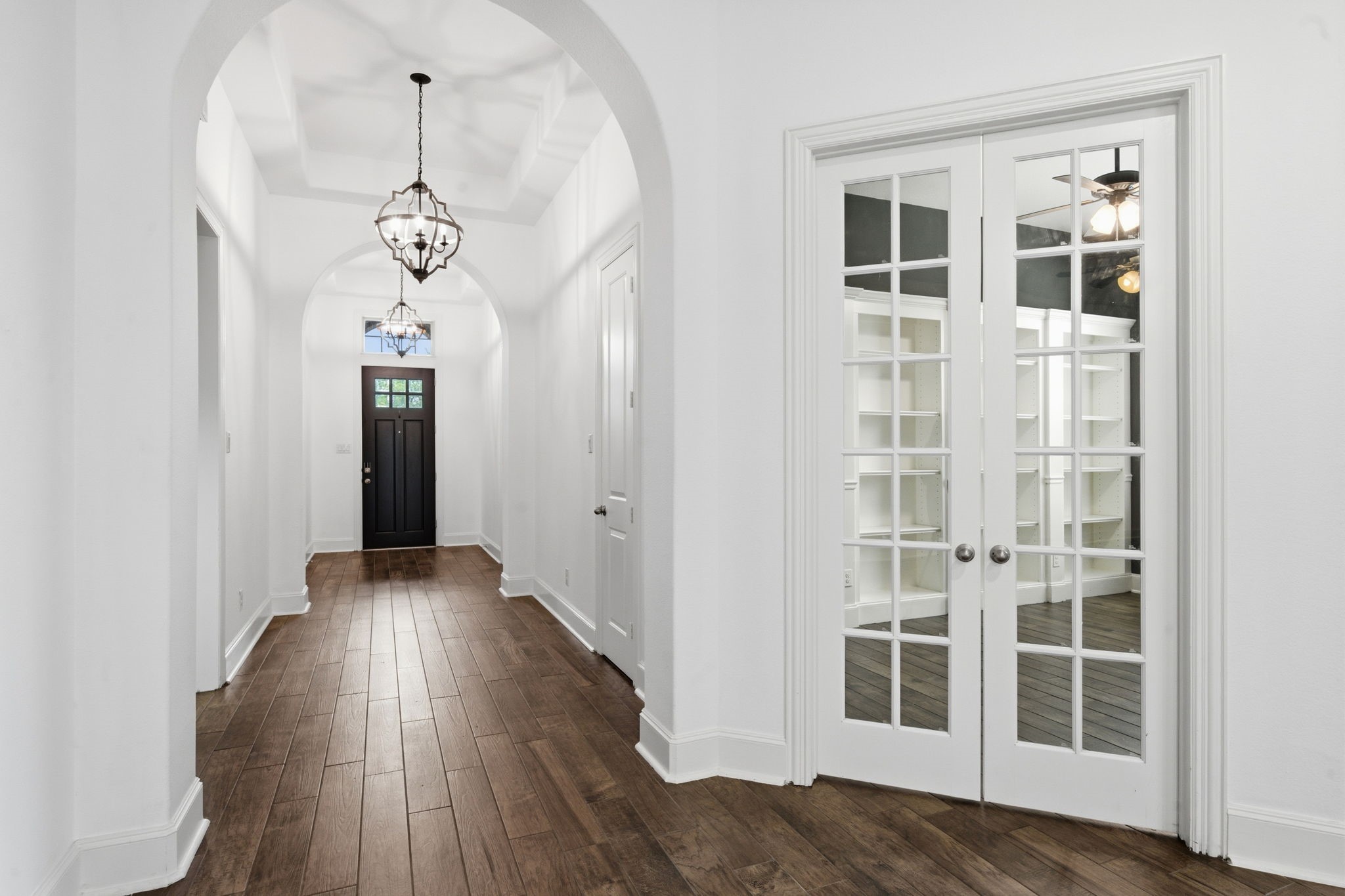 27971 Arden Trail Spring, TX 77386 - Photo 4 of 50 Stunning arched entrance with custom lighting and gorgeous floors.