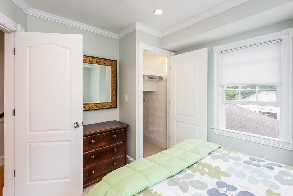 1844 Main Street, Unit 1844 Concord, MA 01742 - Photo 20 of 42 a bedroom with a bed and a dresser in it