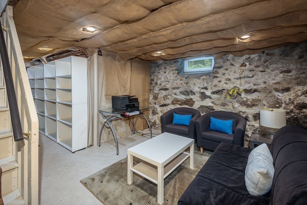 1844 Main Street, Unit 1844 Concord, MA 01742 - Photo 30 of 42 a living room with furniture a rug and a table
