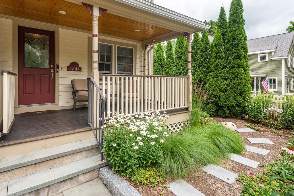 1844 Main Street, Unit 1844 Concord, MA 01742 - Photo 3 of 42 a front view of a house with a yard