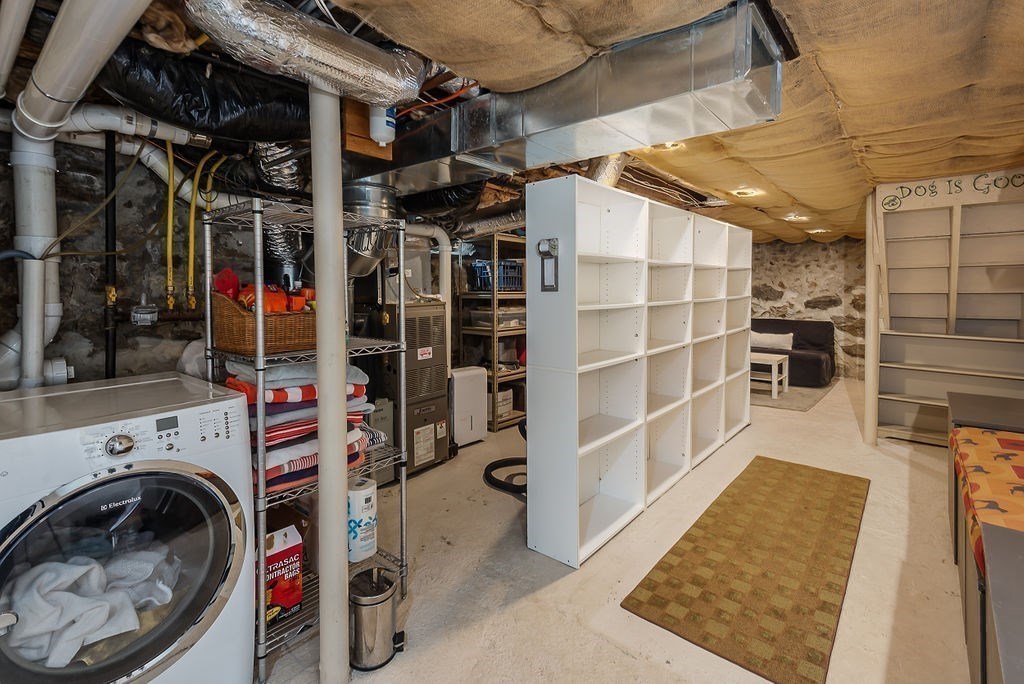 1844 Main Street, Unit 1844 Concord, MA 01742 - Photo 33 of 42 a view of walk in closet with clothes and shoes