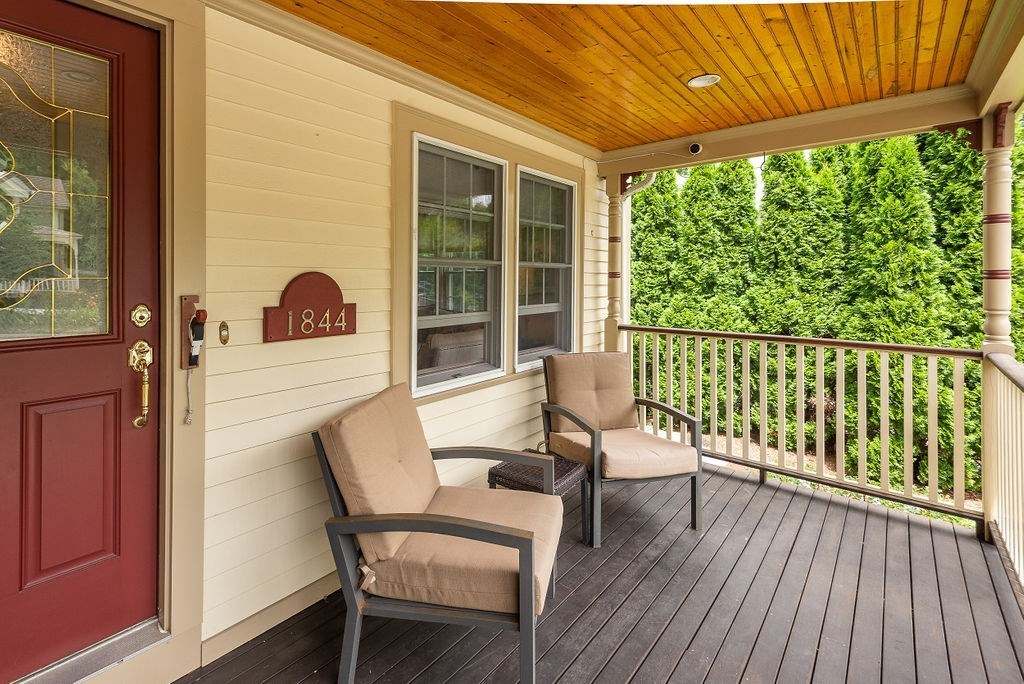 1844 Main Street, Unit 1844 Concord, MA 01742 - Photo 4 of 42 a balcony with table and chairs