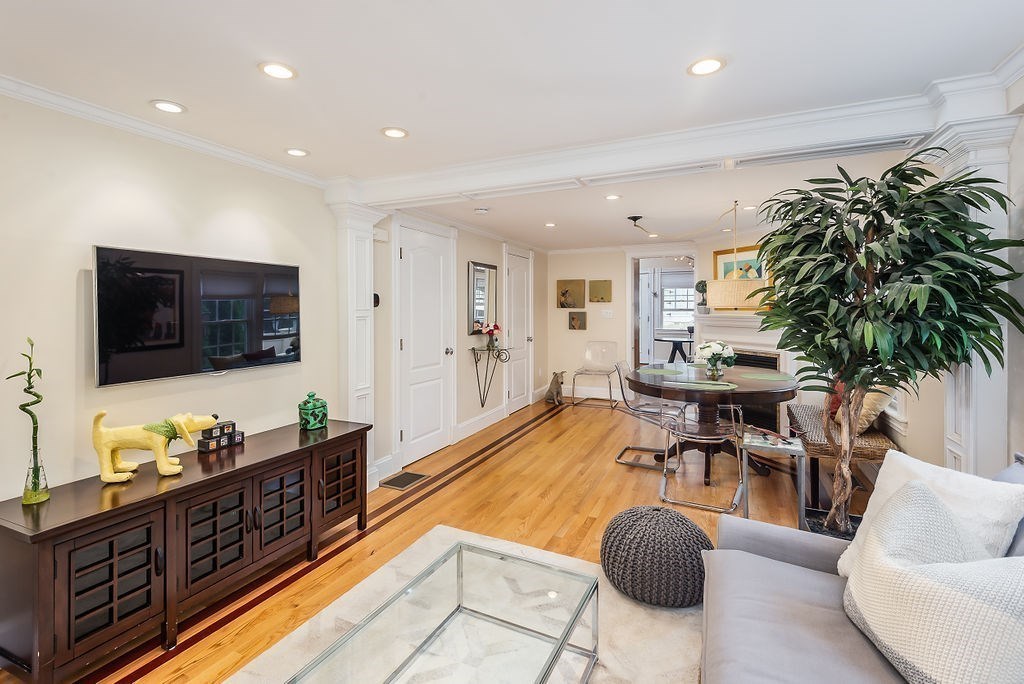 1844 Main Street, Unit 1844 Concord, MA 01742 - Photo 7 of 42 a living room with furniture and a flat screen tv