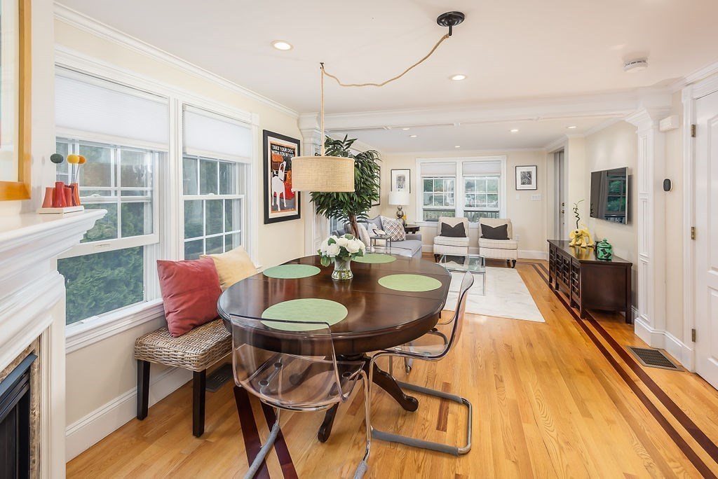 1844 Main Street, Unit 1844 Concord, MA 01742 - Photo 10 of 42 a dining room with furniture a rug and wooden floor