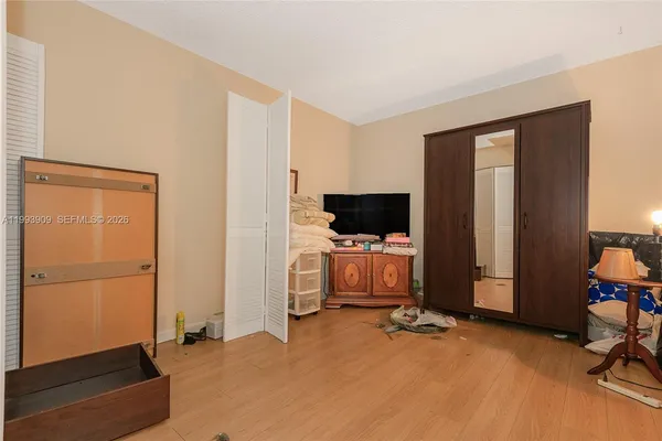 a view of a livingroom with furniture and a flat screen tv