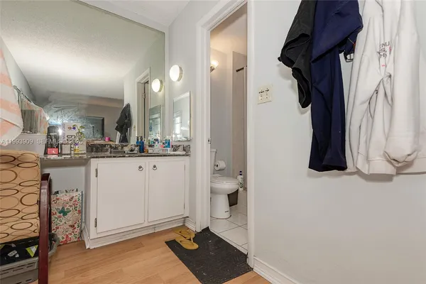 a bathroom with a toilet and a shower curtain