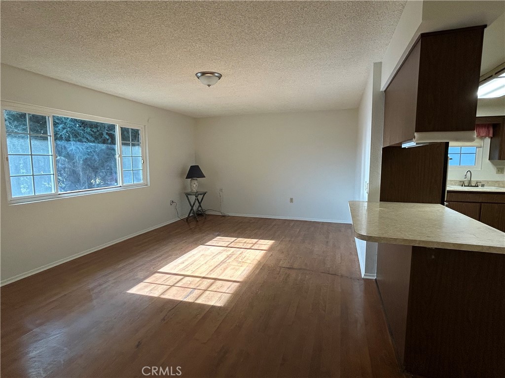 25915 Warwick Road Menifee, CA 92586 - Photo 13 of 34 a view of empty room with wooden floor and fan