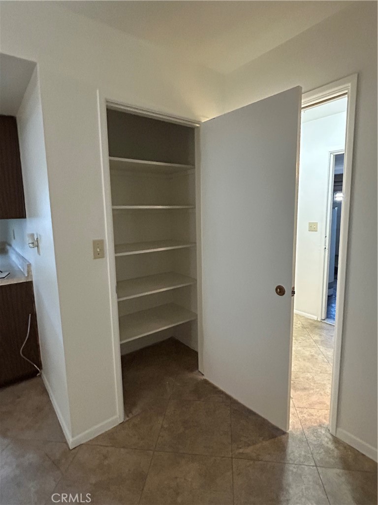 25915 Warwick Road Menifee, CA 92586 - Photo 20 of 34 a view of an empty room with a fireplace