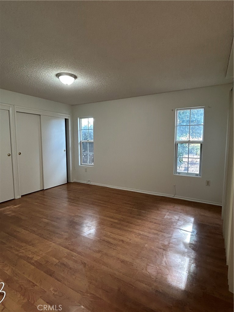 25915 Warwick Road Menifee, CA 92586 - Photo 24 of 34 an empty room with windows