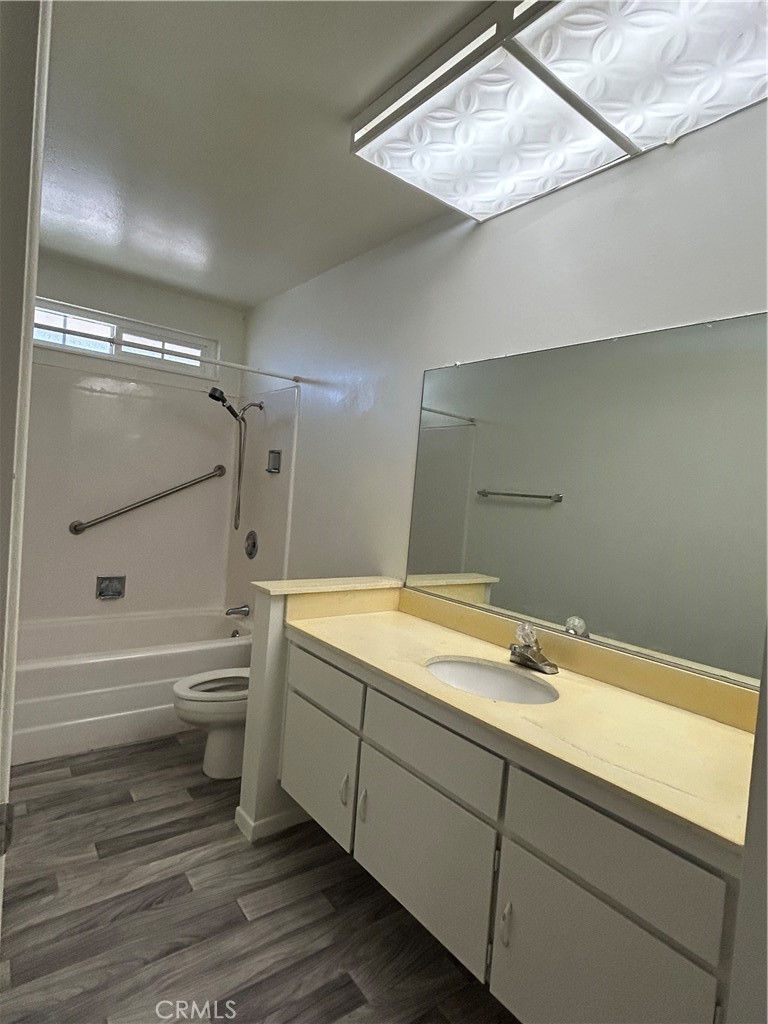 25915 Warwick Road Menifee, CA 92586 - Photo 34 of 34 a bathroom with a bathtub and a shower