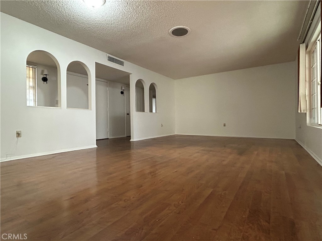 25915 Warwick Road Menifee, CA 92586 - Photo 7 of 34 an empty room with windows