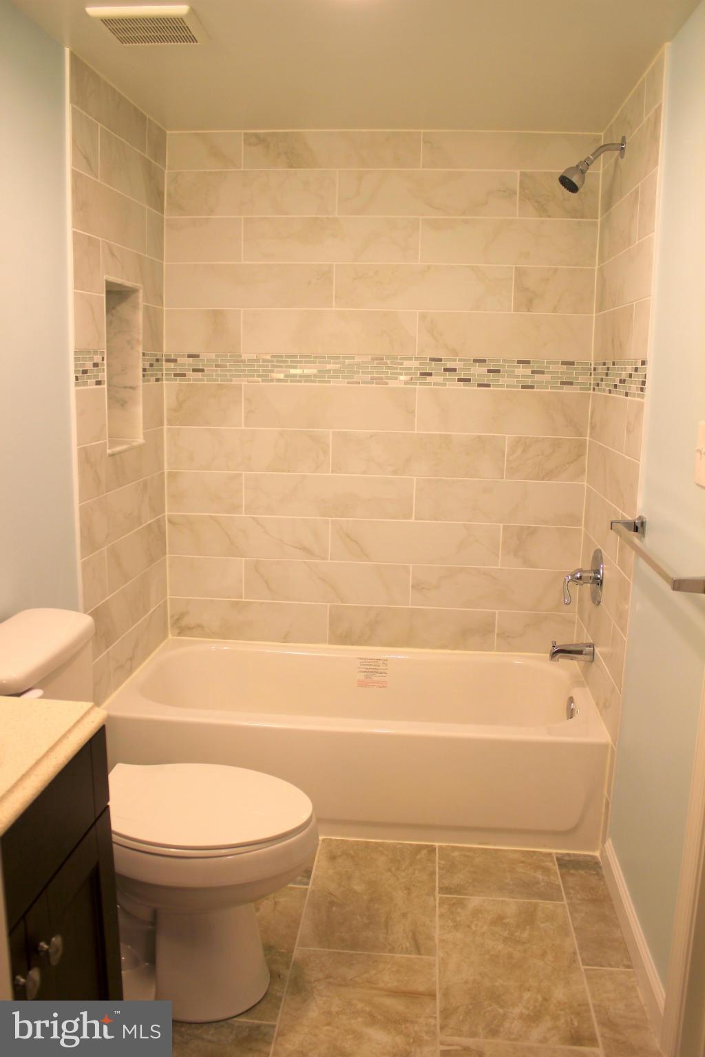 8538 Lucerne Road Randallstown, MD 21133 - Photo 9 of 16 a bathroom with a toilet and a shower