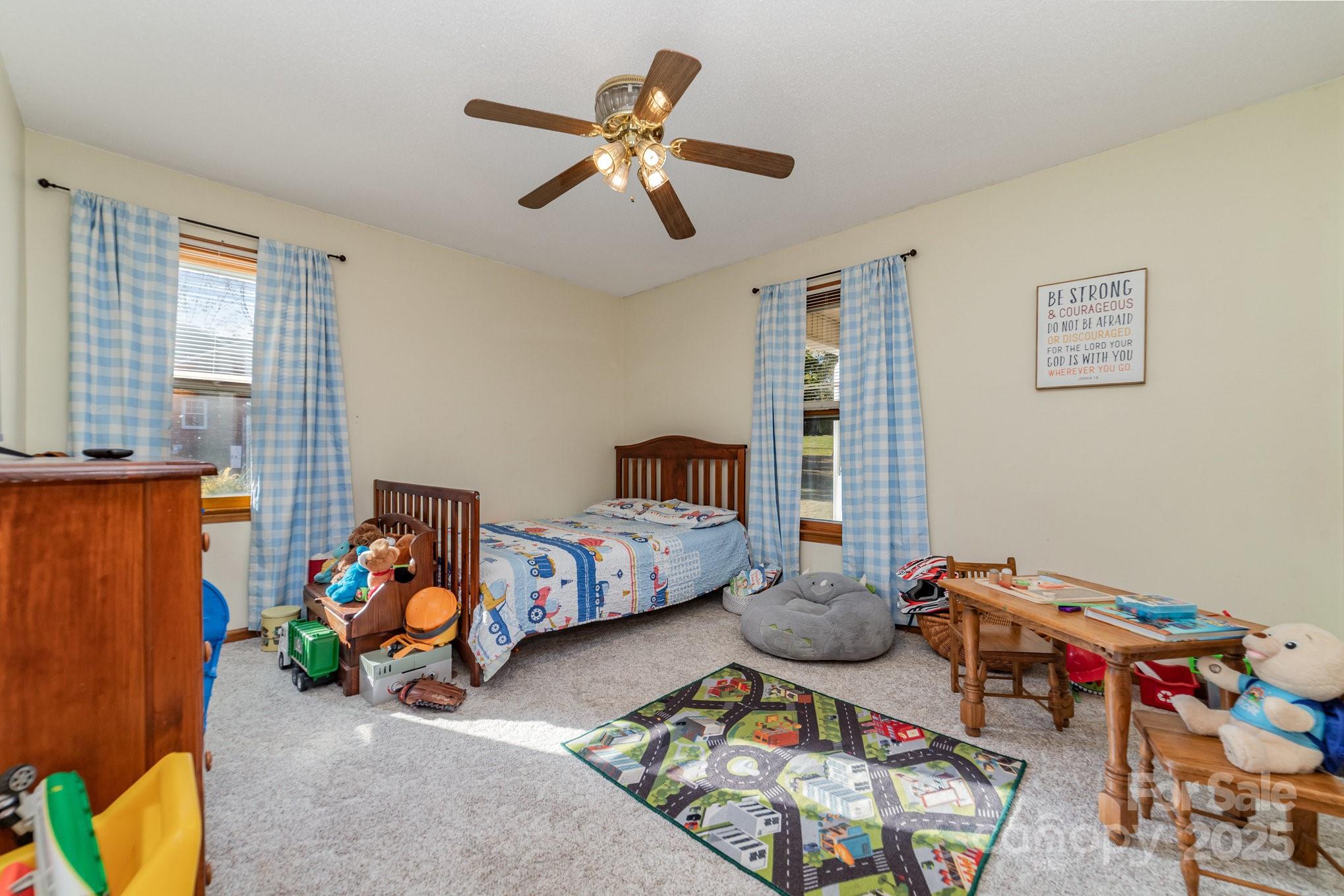 2595 Shamrock Road Harrisburg, NC 28075 - Photo 17 of 27 a bedroom with furniture and a window