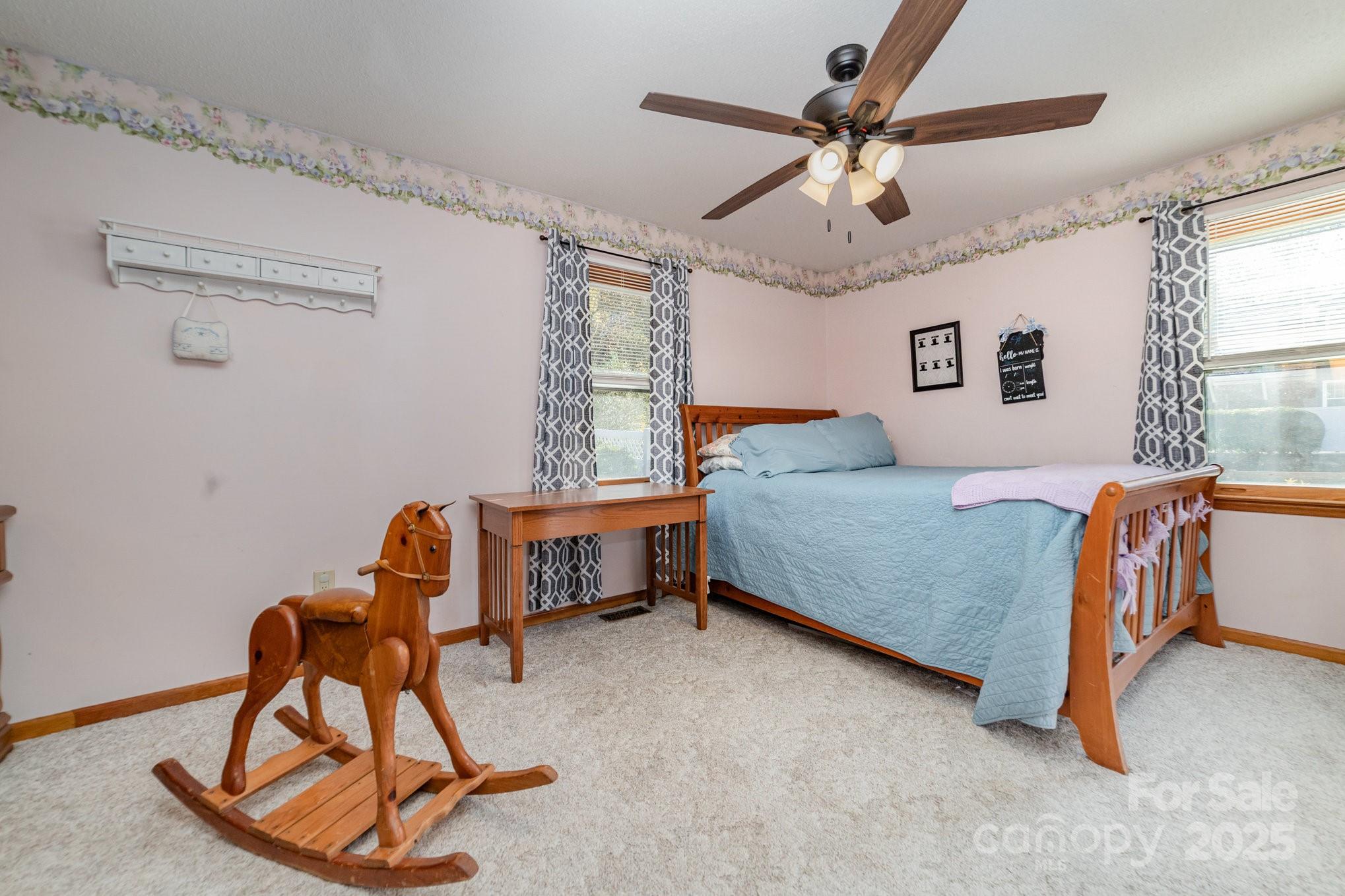 2595 Shamrock Road Harrisburg, NC 28075 - Photo 18 of 27 a bedroom with a bed and a chair