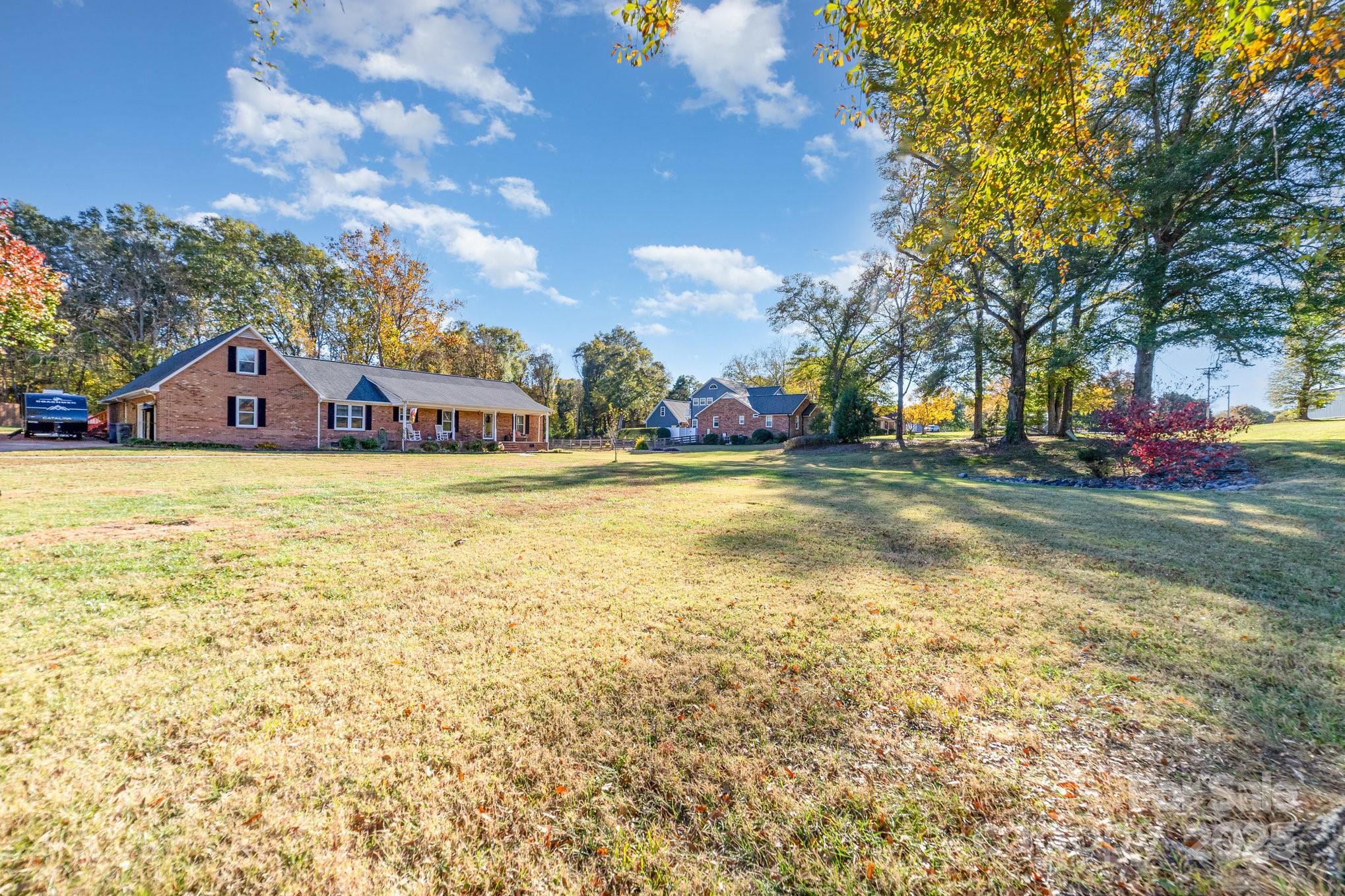 2595 Shamrock Road Harrisburg, NC 28075 - Photo 26 of 27 a view of a town with palm trees